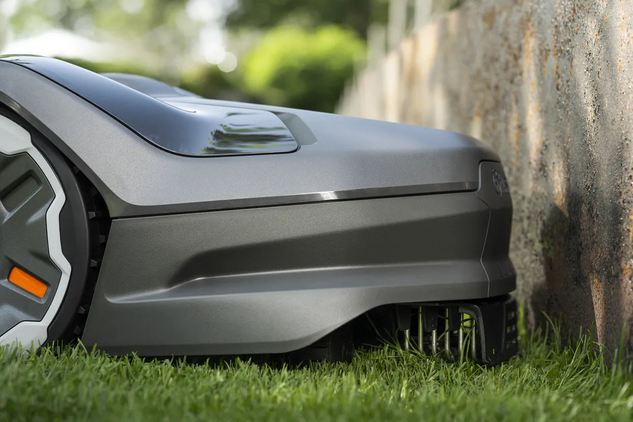 Husqvarna Automower 310E NERA mowing edges close to the tree