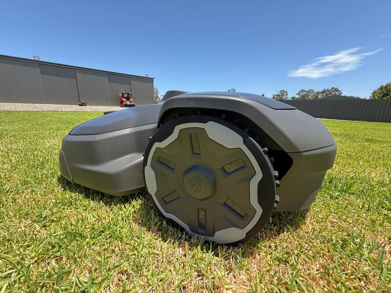 Husqvarna Automower 320 Nera Robotic lawn mower on a grassy area with a clear sky in Murray Bridge-South Australia