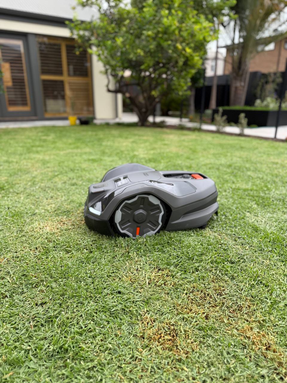 Husqvarna Automower 410XE EdgeCut on the lawn in Brighton-South Australia