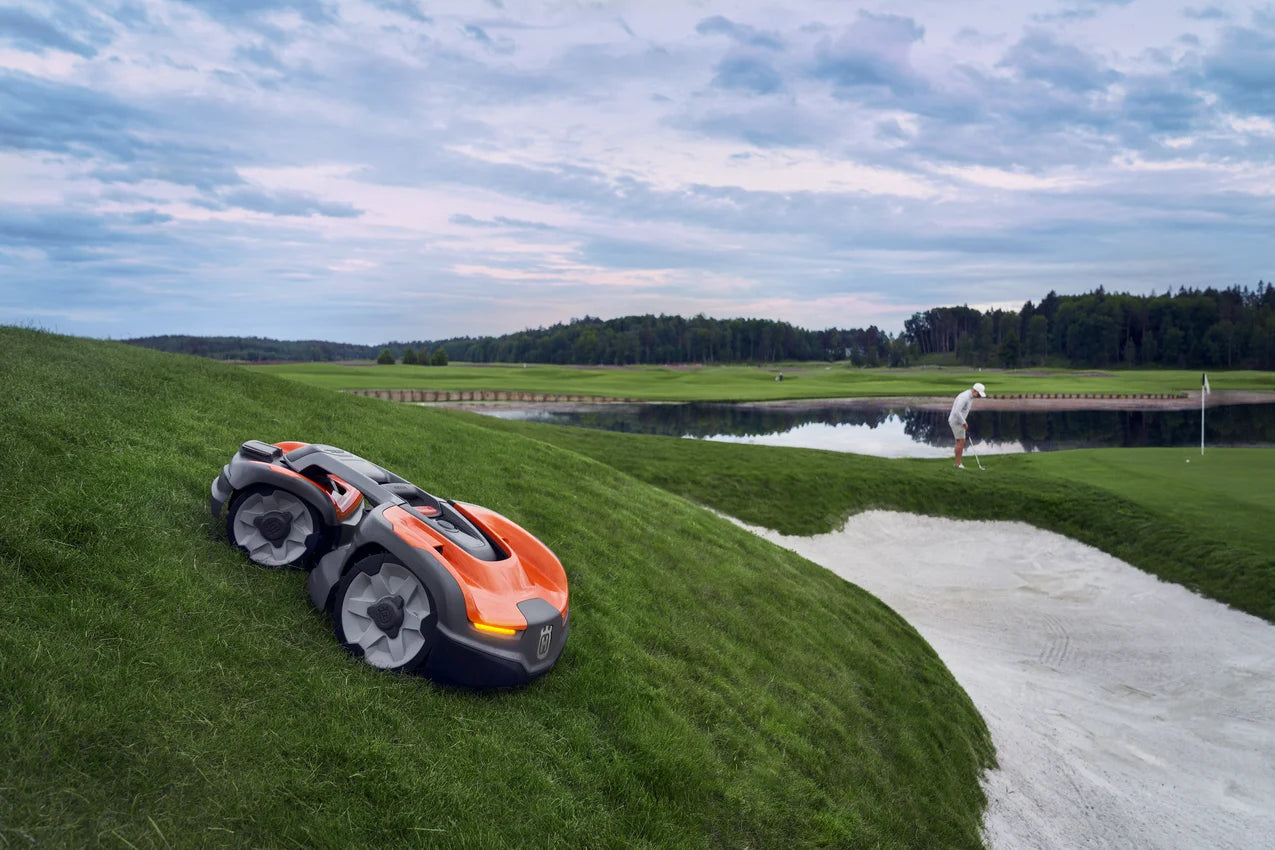 Husqvarna Commercial Automower 535X AWD robotic lawn mower on a golf field mowing slopes