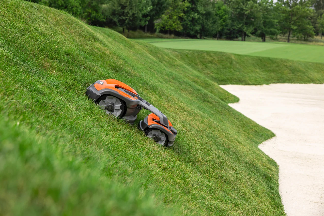 Husqvarna Commercial Automower 535X AWD robotic lawn mower on a steep slope