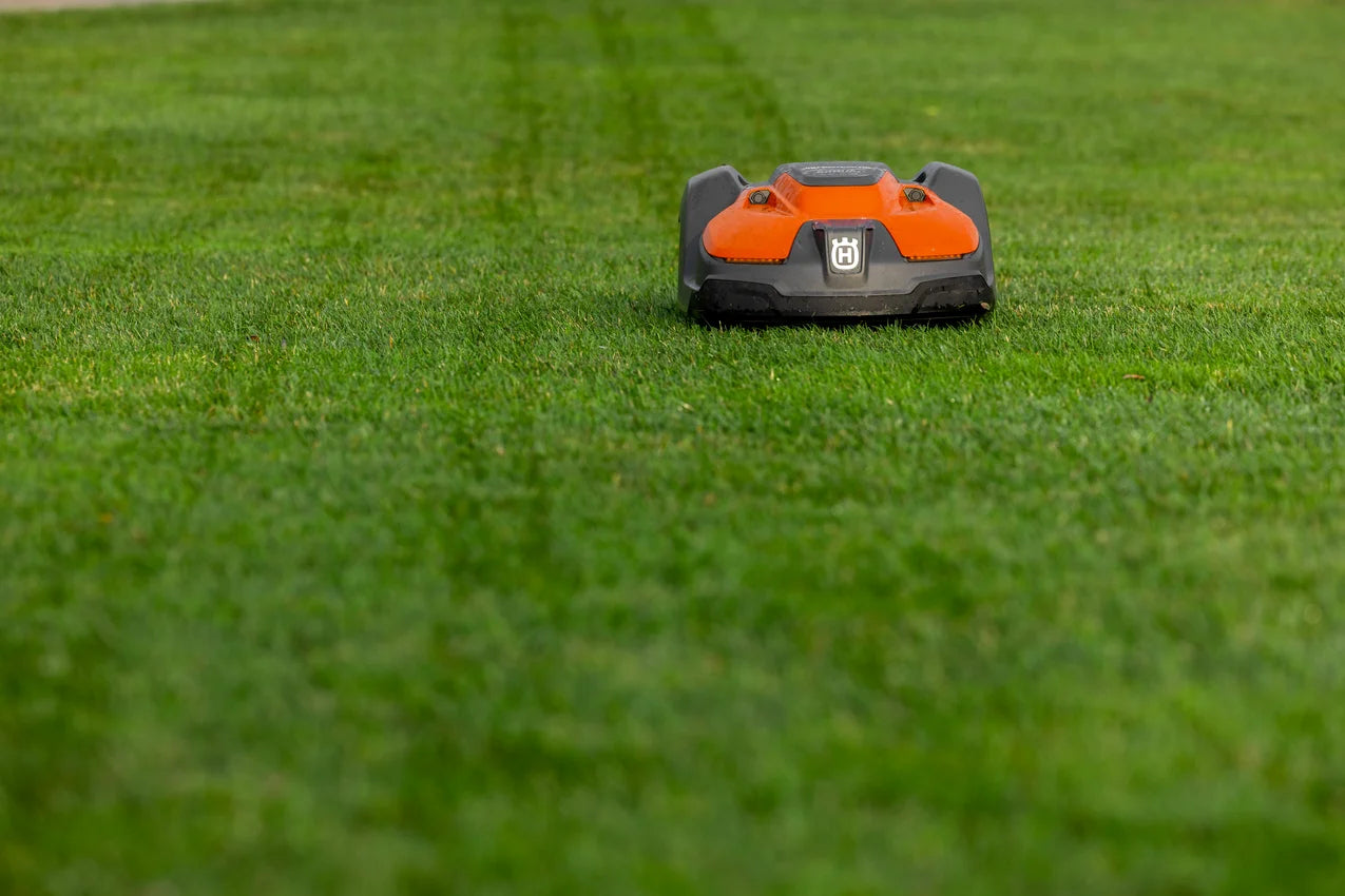 Husqvarna Commercial Automower 550 EPOS wire-free robotic lawn mower on a grassy field