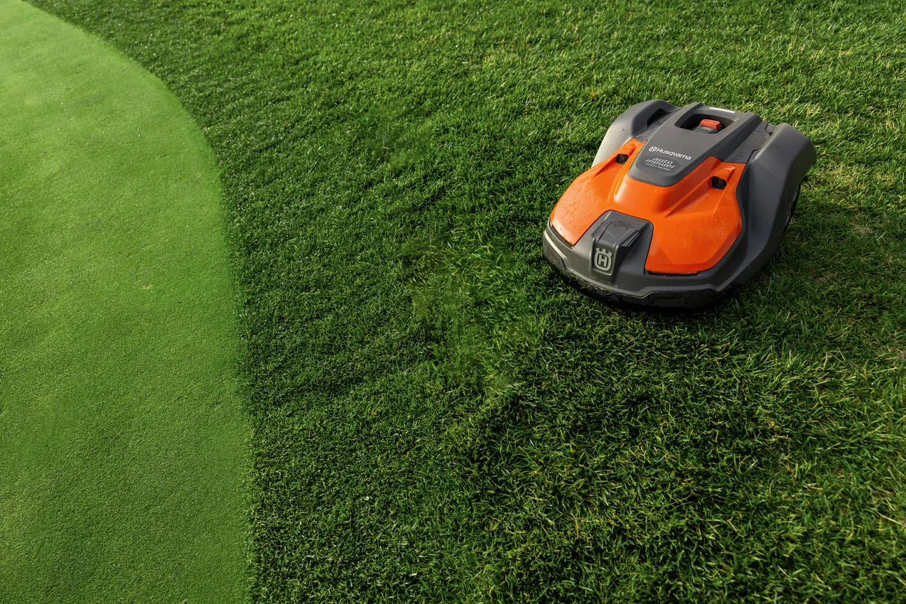 Husqvarna Commercial Automower 550 EPOS on a green lawn near fairway
