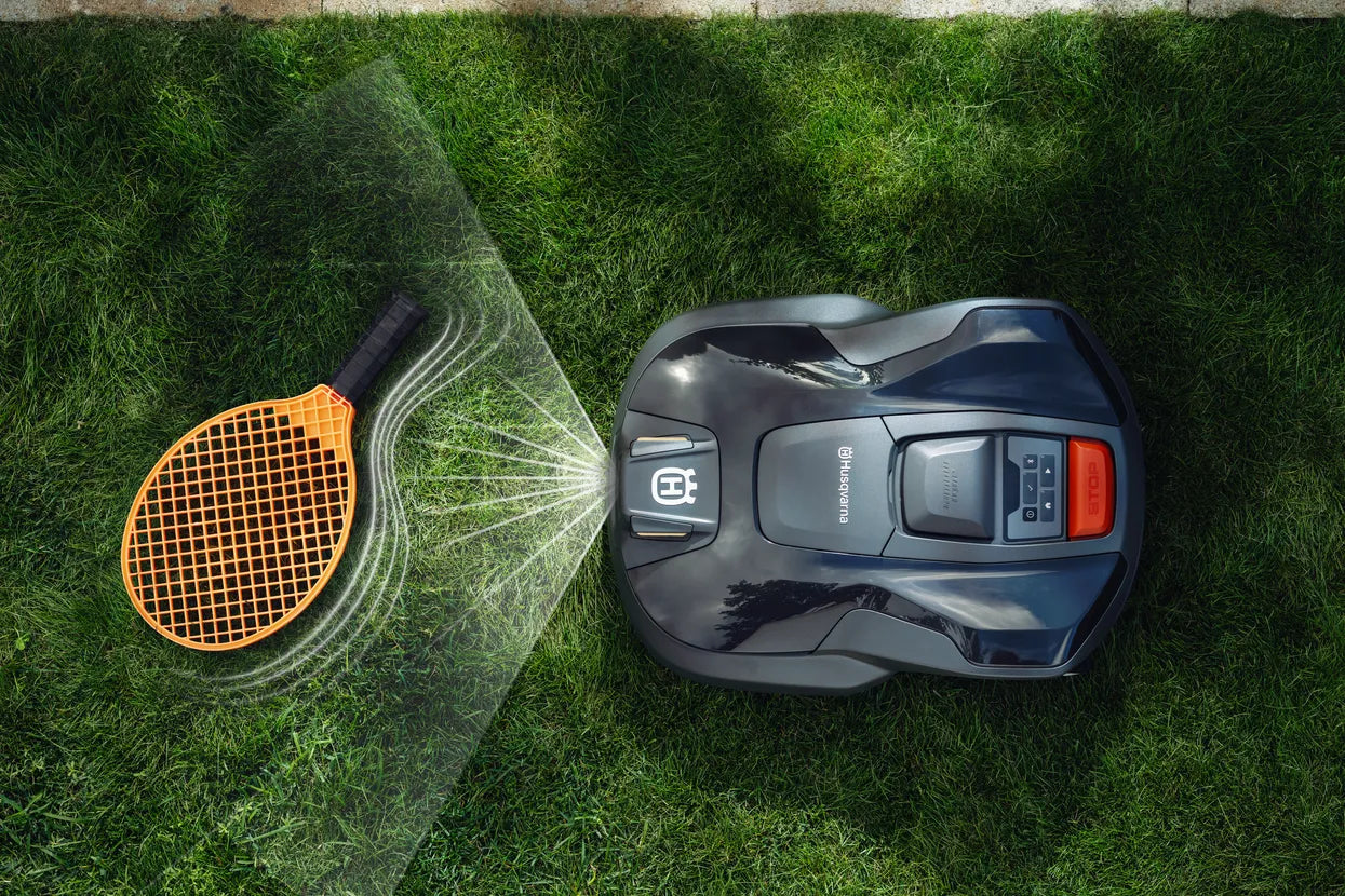 Automower 312V Husqvarna 970 83 11-06 on grass with spray pattern illustration