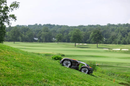 Husqvarna Commercial Automower 535X AWD robotic lawn mower mowing the lawn on a scenic background